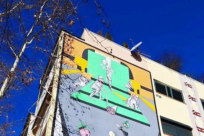 Tirana: Street Art & Modern Architecture Tour - Street art you can actually spot: murals, markings, and the traffic-sign twist